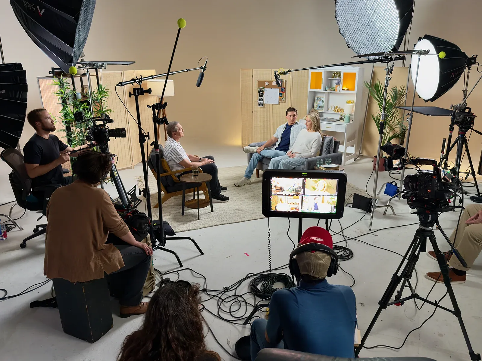 A film production crew capturing an interview on set